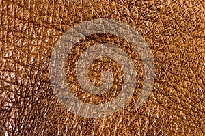 Old vintage genuine soft brown leather texture background, top layer with pores and scratches, macro, close-up