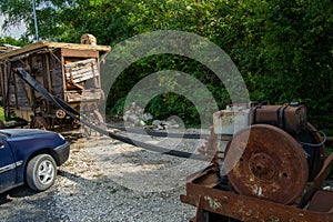 old vintage grain thresher summer day