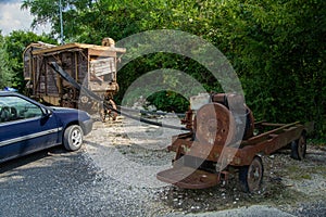 old vintage grain thresher summer day