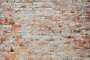 Old vintage and grunge red brick wall background texture with scratches and cracks