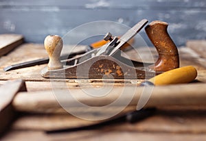 Old vintage hand tools on wood