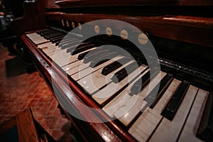 Old vintage harmonium piano keyboard. Close up view