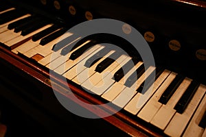 Old vintage harmonium piano keyboard. Close up view