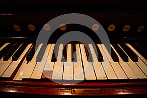 Old vintage harmonium piano keyboard. Close up view