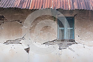 Old vintage house, background texture of a cracked and eroded wa