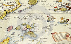 Old vintage illustration part of world map close up view with mermaid, sea monsters and islands