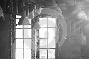 Old vintage Industrial interior with bright light coming through windows. Beautiful sunlight