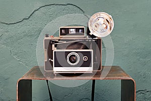 Old vintage instant camera with bellows