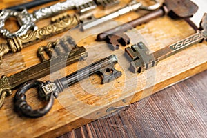 Old vintage keys on a wooden background