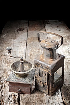 Old vintage lamp with coffee mill on wooden table