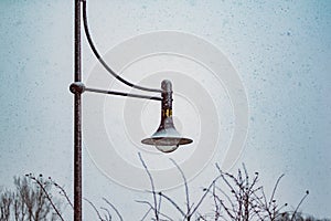 Old vintage lantern in front of winter sky