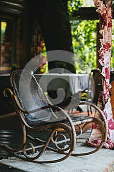 Old vintage leather rocking chair on the veranda