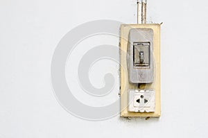Old vintage light switch and electric plug socket.