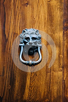 Old vintage lion head door knocker.