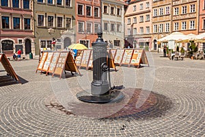 Old vintage mechanical water pump on the historic Old Town Market Square, Warsaw, Poland