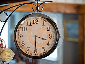 Old vintage metal Wall clock decorating indoor environment