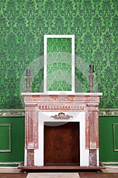 Old vintage mirrod in woden frame on chimney