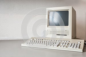 Old vintage monitor and computer on desk, retro workplace with copy space business, technology,internet concept