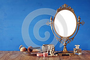 Old vintage oval mirror and woman toilet fashion objects