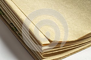 Old vintage paper documents on white background paper corners with free blank space and selective focus with depth of field