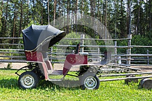 Old vintage passenger carriage for horse harnessing