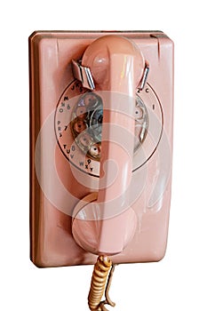 An old vintage Pink Telephone isolated on a white background