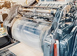 Old vintage printing machine for cutting cardboard in the printing house. Box, production