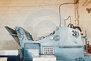 Old vintage printing machine in the print shop. Magazine, newspaper, brochure, paint