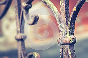 Old vintage railing with rust on the stairs in the house. Forged railing steps in the house