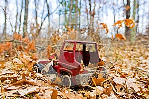 Old vintage red toy truck found in the woods near Governor Knowles State Forest in Northern Wisconsin - taken in Autumn with truck photo