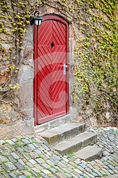 old vintage red wooden door Marburg Germany