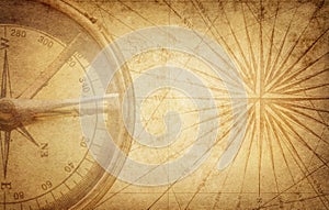 Old vintage retro compass on ancient map. Survival, exploration