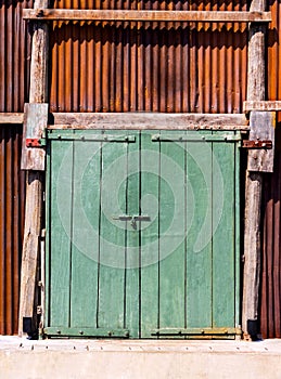 The old vintage retro door made of hardwood and old zine with ru