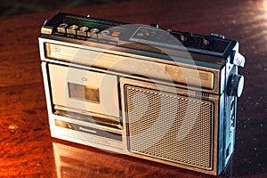 An old, vintage retro style silver boom box or radio cassette tape player