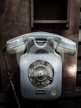 Old vintage retro-styled telephone with rotary dial