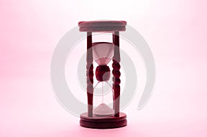 Old vintage retro wooden hourglass on white background