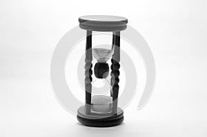 Old vintage retro wooden hourglass on white background