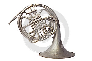 Old vintage silver French horn on a on white background