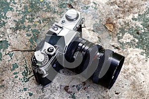 Old and vintage single lens reflex or SLR film camera at an outdoor park