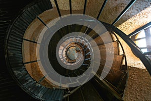 Old Vintage Spiral Staircase In Abandoned Mansion House. Top View photo