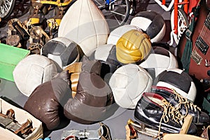 Old vintage sporting goods - balls, boxing and ice skates