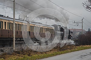 Old vintage steam train with black locomotive