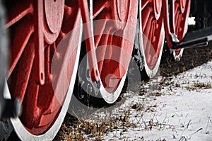 Old vintage steam train, locomotive, train with red wheels, old carriages, close-up to the wheels