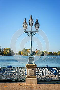 Old vintage street lamp on the lake of Enghien les Bains near Paris France