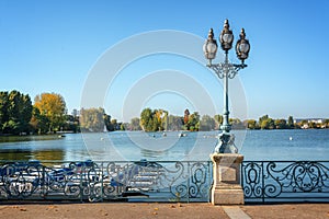 Old vintage street lamp on the lake of Enghien les Bains near Paris France