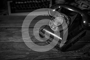 Old vintage telephone on a desk, cinematic noir scene
