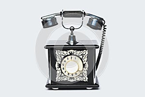 Old vintage telephone on light grey background photo