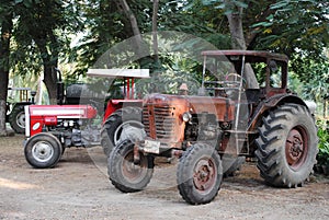 Old vintage tractors in field