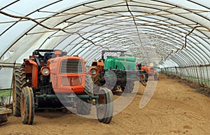 Old vintage tractors from the sixties still working, in an agricultural shed