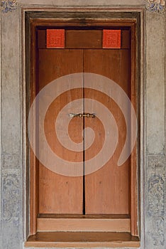 Old vintage traditional wooden door and cement wall